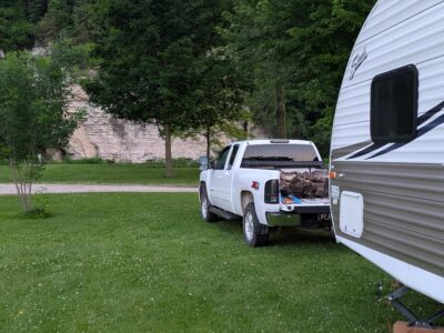 pull through rv sites in bluffton RV Park campsite with travel trailer and pickup at Bluffton Resort & Bar
